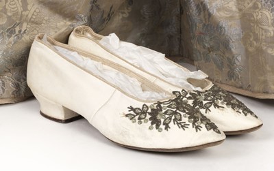 Lot 718 - Clothing.  A blue brocade skirt, circa 1850s, & other skirts, shoes, and waistcoats