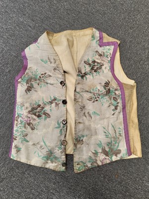 Lot 718 - Clothing.  A blue brocade skirt, circa 1850s, & other skirts, shoes, and waistcoats
