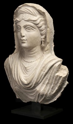 Lot 564 - Palmyrene Empire. A limestone bust of a female, mid-2nd century A.D.