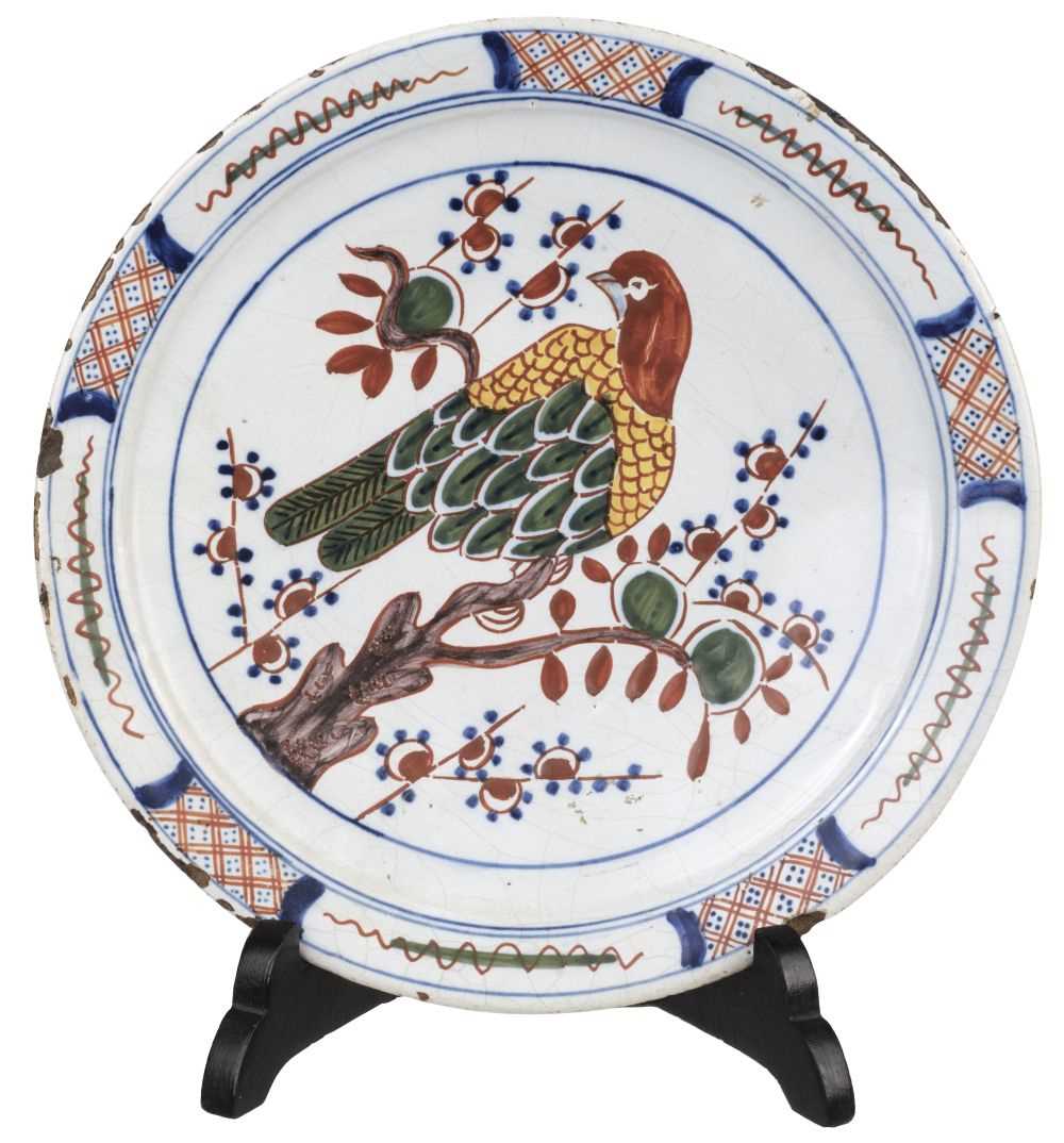 Lot 494 - Delft. A pair of Dutch delft 'parrot' plates, 18th century