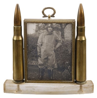 Lot 392 - Trench Art. A WWII brass airman's tribute frame