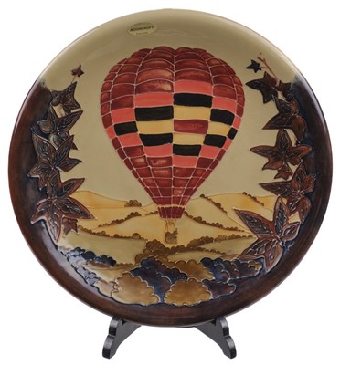 Lot 526 - Moorcroft Pottery. A large Moorcroft tube lined pottery charger