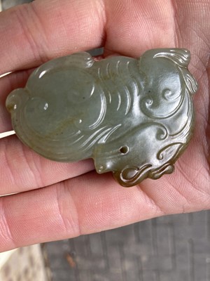 Lot 490 - Jade. A jade panel, carved as a carp catching a dragonfly and other pieces