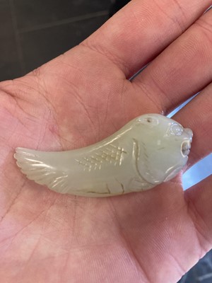 Lot 490 - Jade. A jade panel, carved as a carp catching a dragonfly and other pieces