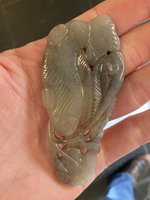 Lot 490 - Jade. A jade panel, carved as a carp catching a dragonfly and other pieces