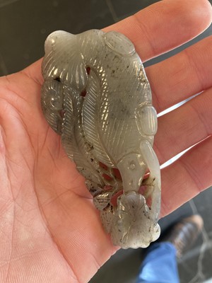 Lot 490 - Jade. A jade panel, carved as a carp catching a dragonfly and other pieces