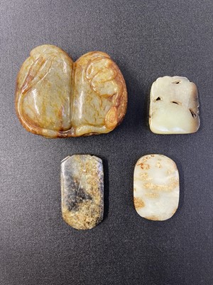 Lot 487 - Jade. A Chinese jade boulder, carved as two fruit with a bat to the right and other carvings