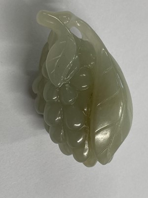 Lot 488 - Jade. A Chinese jade fruit, carved as berries and vine and other pieces