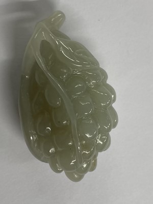 Lot 488 - Jade. A Chinese jade fruit, carved as berries and vine and other pieces