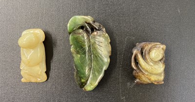 Lot 491 - Jade. A spinach green jade boulder and other pieces