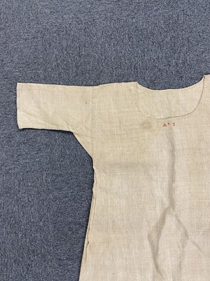 Lot 310 - Bed Linen. An early 18th century pillowcase, 1710, & a linen night gown