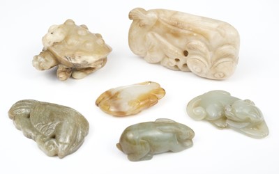 Lot 656 - Jade. A Chinese jade carving of a recumbent feline cub and other animals