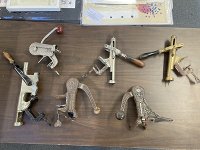 Lot 713 - Corkscrews. A collection of Victorian and later bar mounted corkscrews