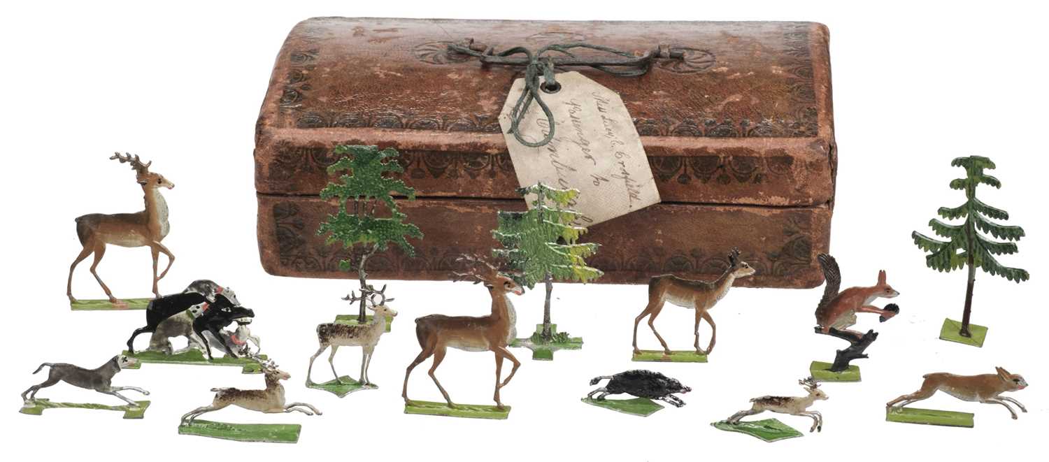 Lot 477 - Toy Animals. A collection of small painted metal toy animals and figures, mid 19th century