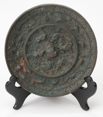 Lot 662 - Mirror. A Chinese bronze hand mirror, believed to be Ming period or earlier