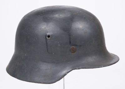 Lot 261 - German Helmets. A WWII German M42 "raw-edge" steel helmet by Emaillierwerke Fulda
