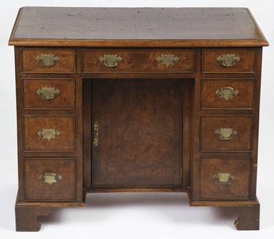 Lot 673 - Desk. A George II style walnut kneehole desk, the rectangular top with burr walnut veneer