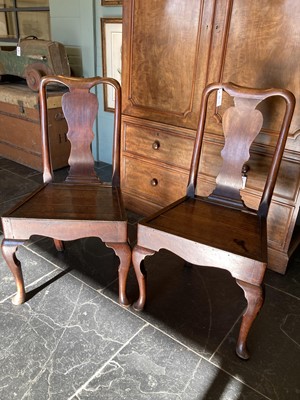 Lot 670 - Chairs. A pair of George II oak 'country' chairs