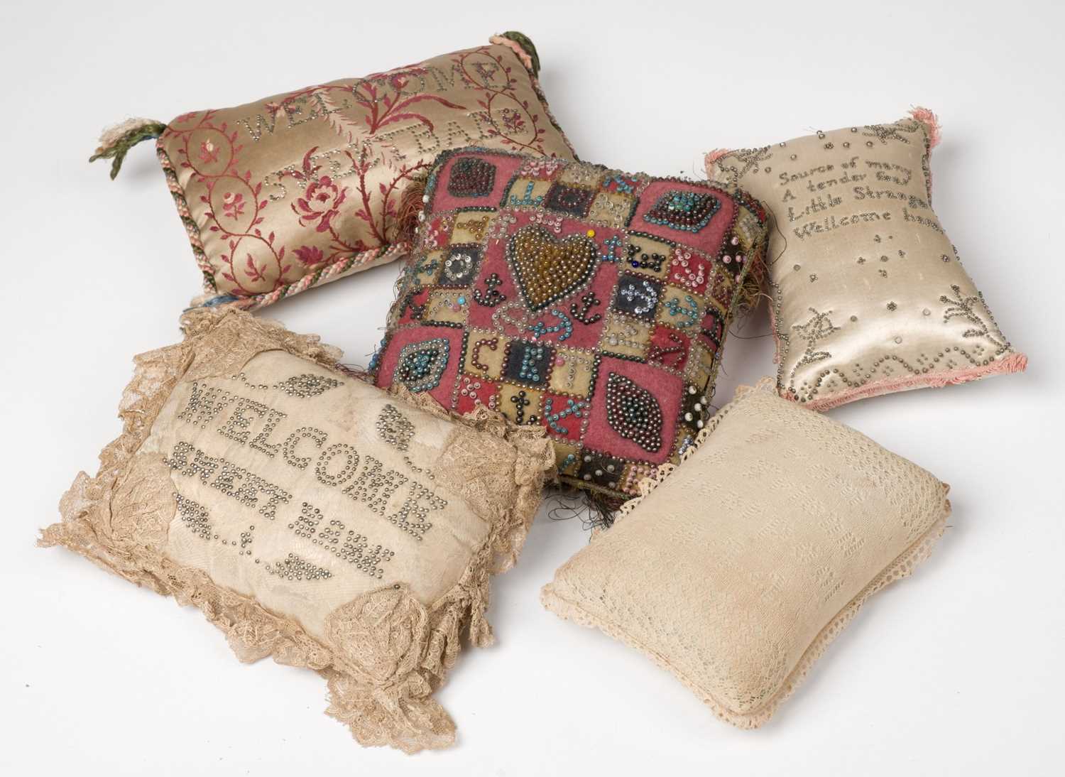 Lot 467 - Sewing. An 18th century pinwork pincushion, & 4 others
