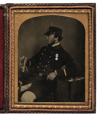Lot 115 - Ambrotype of a naval officer in profile holding his sword and wearing a medal, c. 1855