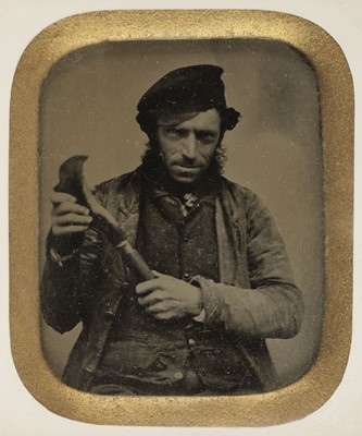 Lot 119 - Ambrotype. Sixth-plate ambrotype of a carpenter holding a billhook, c. 1860