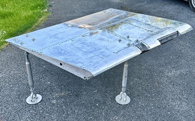 Lot 408 - F-4 Phantom Jet. A table made from an F-4 Phantom wing flap