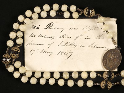 Lot 317 - Pope Pius IX (1792-1878). A white and coloured glass with metal rosary with small medal