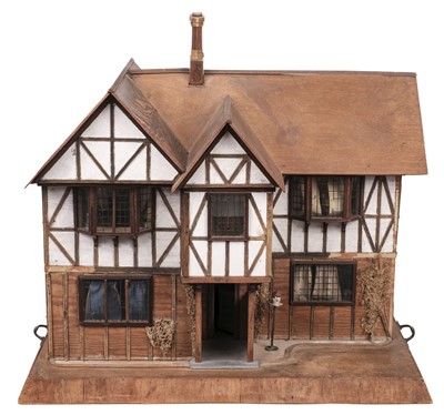 Lot 479 - Dolls' House. A bespoke half-timbered Tudor-style dolls' house, 1930s, & accessories