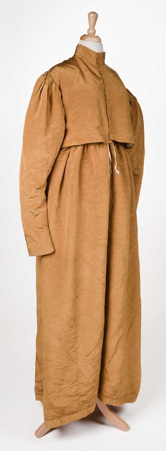 Lot 423 - Clothing. A gold moiré silk maternity gown, circa 1820s