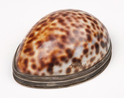 Lot 605 - Snuff box. A George III silver mounted Cowrie shell snuff box