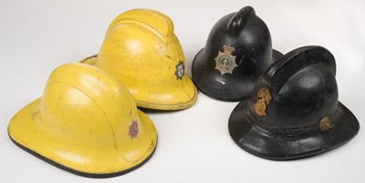 Lot 182 - Fire Fighting. A collection of British fireman's helmets