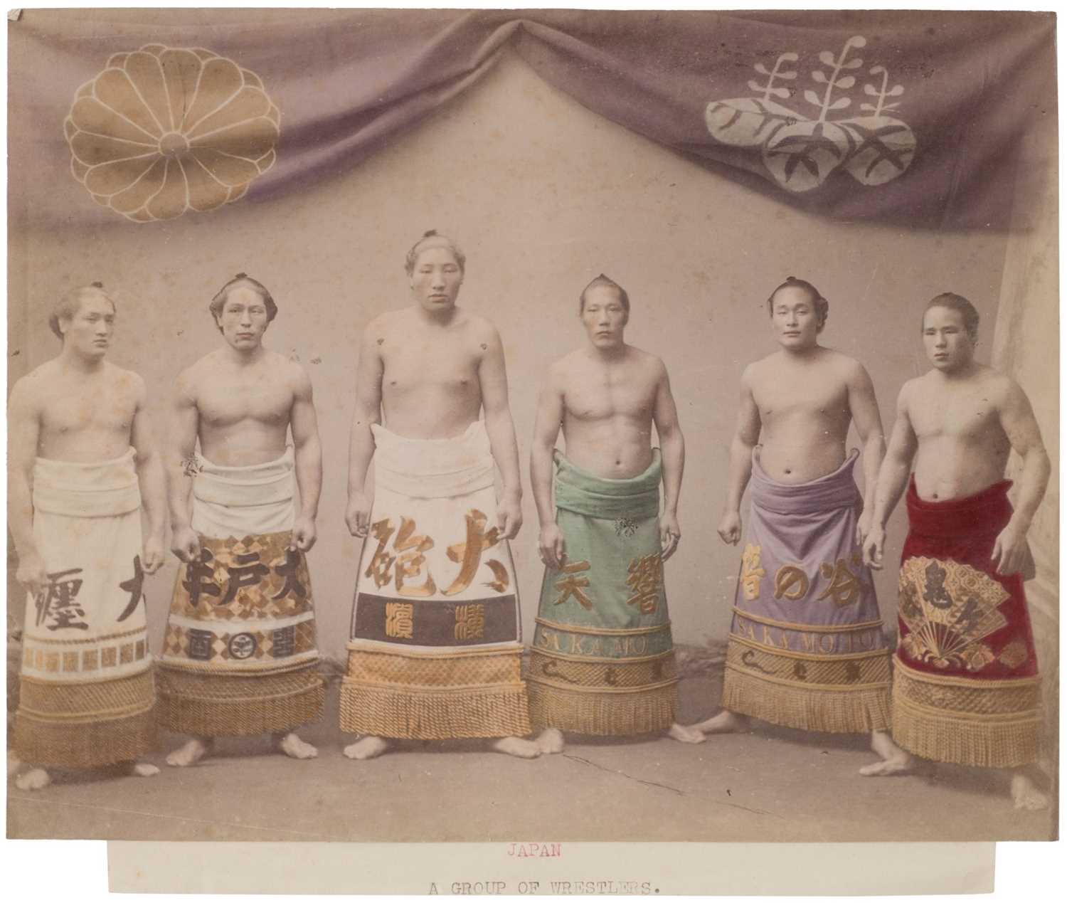 Lot 27 - Japan. A group of wrestlers, c. 1890s, hand-tinted albumen print