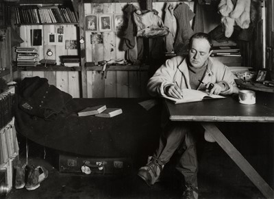 Lot 95 - Ponting (Herbert). Captain Scott writing up his journal..., modern gelatin silver prints