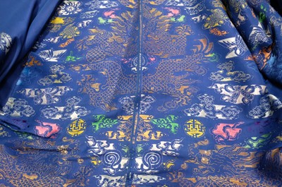 Lot 451 - Chinese Dragon Robe. A silk brocade nine-dragon robe, late Qing Dynasty