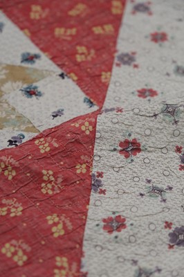 Lot 511 - Quilt. A broderie perse bedcover of 18th century chintz, early 19th century