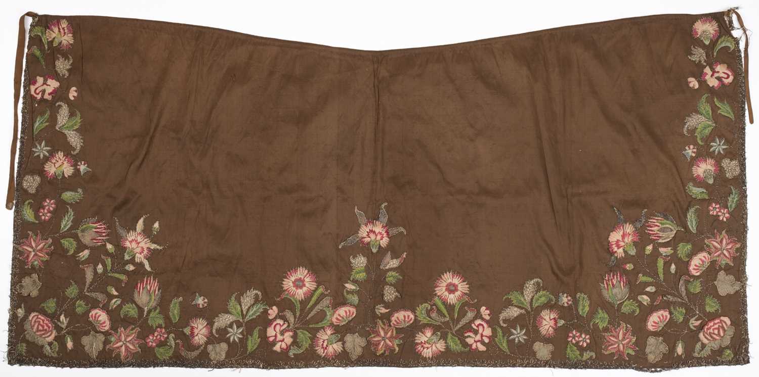 Lot 275 - Embroidered Apron. A silk apron appliquéd with embroidered slips, circa 1720