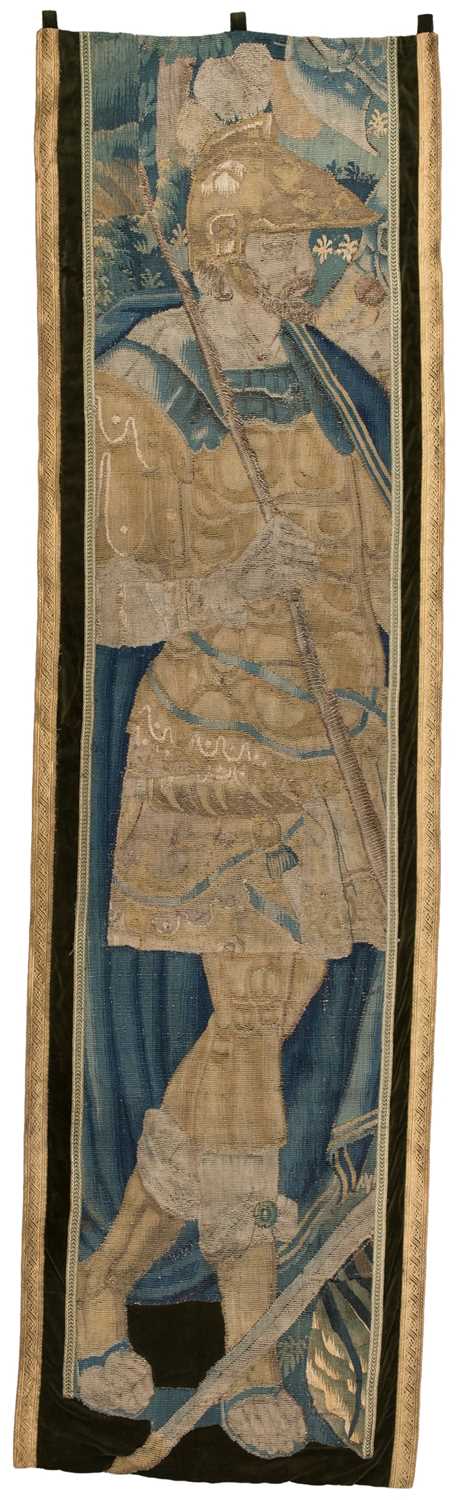Lot 297 - Tapestry. A long panel depicting a halberdier, Continental, 17th/early 18th century