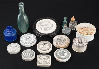 Lot 403 - Advertising pot lids. A large collection of Victorian ceramic pot lids and ink bottles