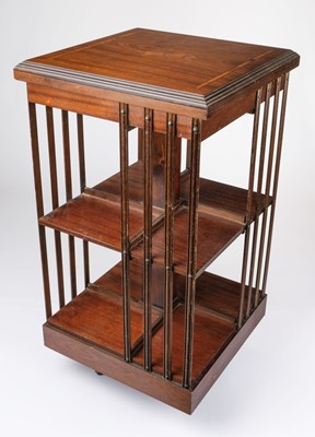 Lot 338 - Bookcases. An Edwardian style mahogany inlaid revolving bookcase