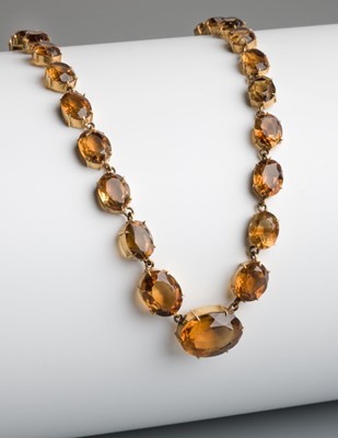 Lot 503 - Necklace. An early 20th Century yellow metal Citrine rivière necklace