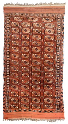 Lot 265 - Carpets. A large Oriental Bochara woollen carpet, 20th century, and two others