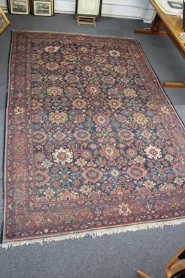 Lot 265 - Carpets. A large Oriental Bochara woollen carpet, 20th century, and two others