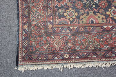 Lot 265 - Carpets. A large Oriental Bochara woollen carpet, 20th century, and two others