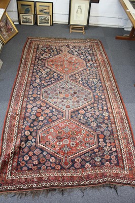 Lot 265 - Carpets. A large Oriental Bochara woollen carpet, 20th century, and two others