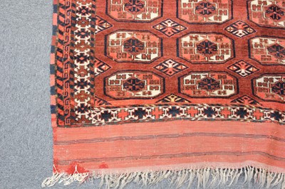 Lot 265 - Carpets. A large Oriental Bochara woollen carpet, 20th century, and two others