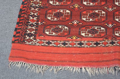 Lot 265 - Carpets. A large Oriental Bochara woollen carpet, 20th century, and two others