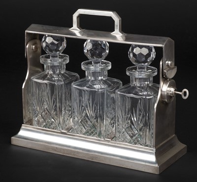Lot 426 - Tantalus. An Edwardian style silver-plated tantalus