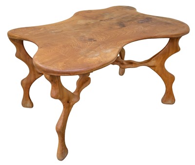Lot 446 - Table. A modern abstract carved elm table