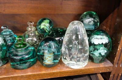Lot 401 - Paperweights. A large collection of Victorian green glass dump paperweights