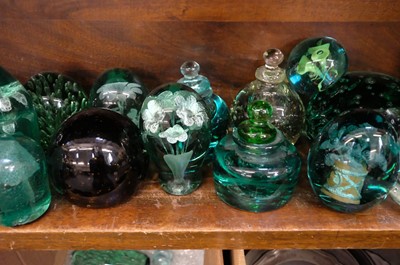 Lot 401 - Paperweights. A large collection of Victorian green glass dump paperweights